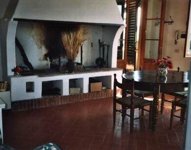 the kitchen with the fireplace